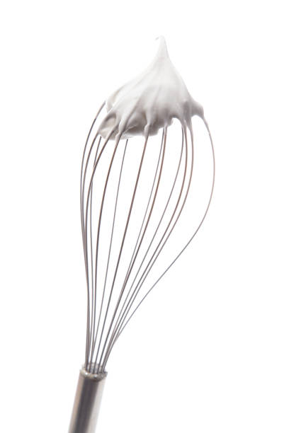 istock Whipped Cream with a Whisk on a White Background 1037732440