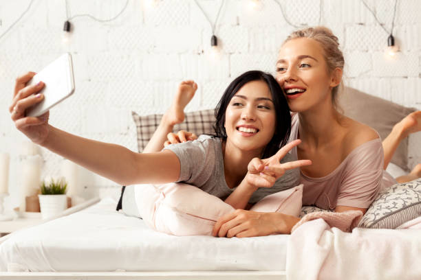 istock Charming girls posing in light room 1037736402