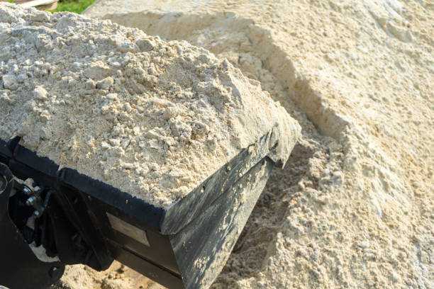 istock Sand for construction works is collected in a loader bucket. 1037743566