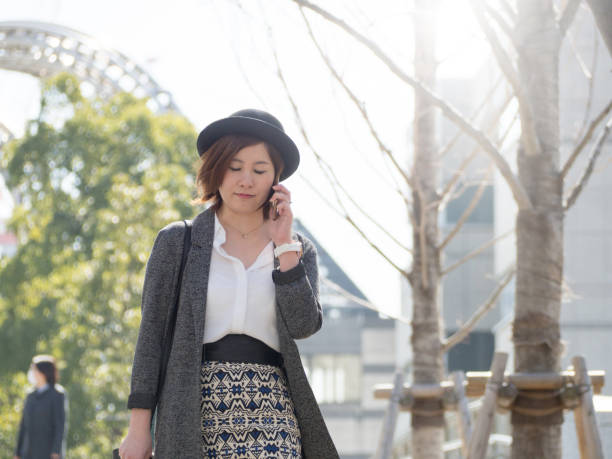 istock Asian woman talking seriously on the phone 1037754554