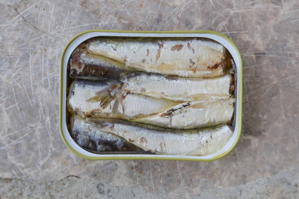 istock Open can of sardines in oil, top view 1037785452