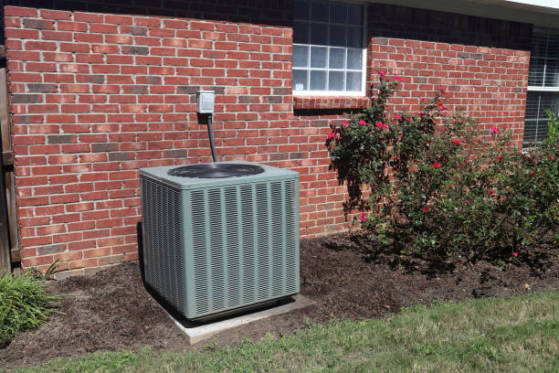 istock Air conditioner system next to home with brick wall. 1037794672