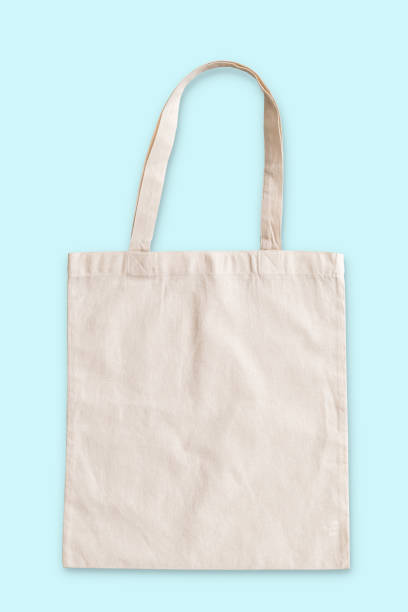 istock Tote bag fabric cloth shopping sack mockup isolated on blue background (clipping path) 1037811276
