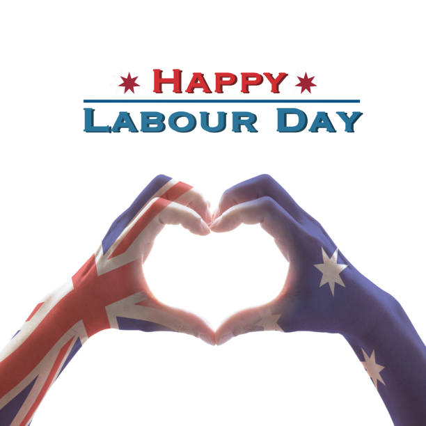 istock Happy labour day with Australia flag pattern on people hands in heart shape on whitw background 1037811338