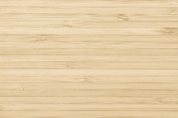 istock Bamboo wood texture background in natural light yellow cream color 1037811892