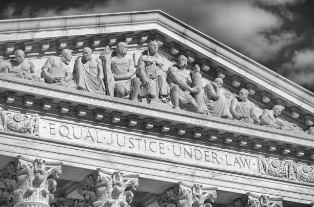 US Supreme Court Building Detail Close-Up Close-up in black and white of the message "Equal Justice Under Law" inscribed in the classically detailed US Supreme Court building in Washington, DC, USA us supreme court building stock pictures, royalty-free photos & images