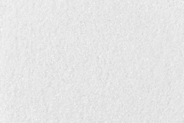 istock White glitter texture on macro. High resolution photo. 1037816872