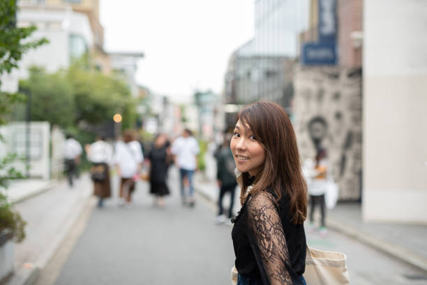 istock Woman walking on stylish path in Harajuku 1037825926