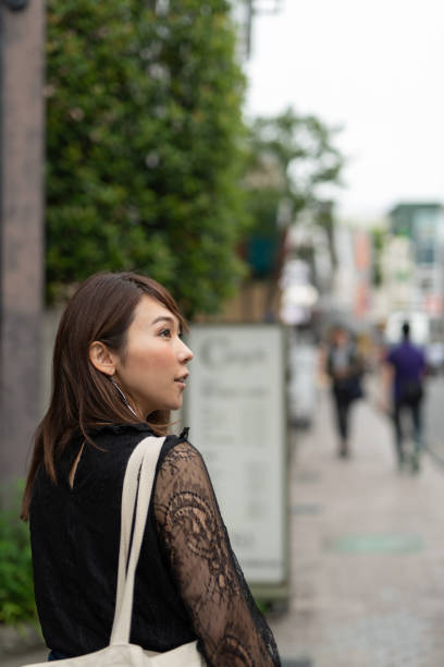 istock Woman walking on stylish path in Harajuku 1037826024