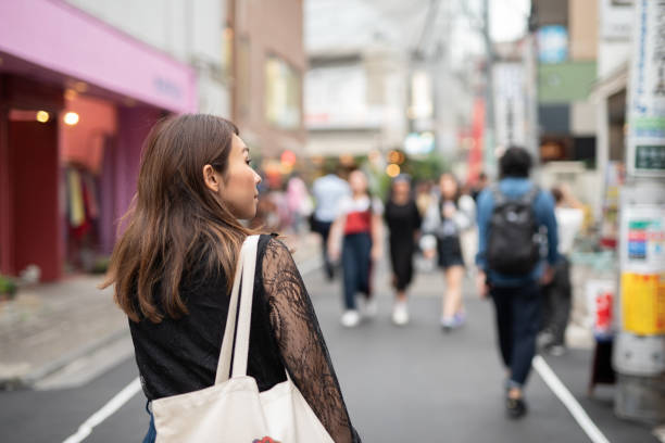 istock Woman walking on stylish path in Harajuku 1037826106