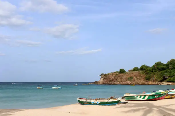 Photo of The white sand beach and quiet wave of Dutch Bay in Trincomalee