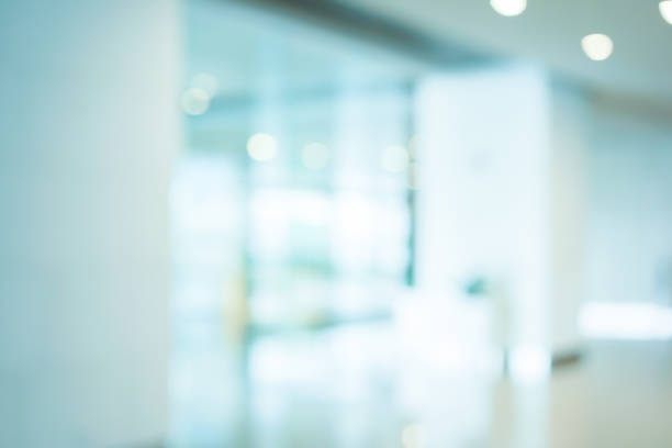 istock abstract blurred workplace interior with modern glass window reflective background ; loft style contemporary design of lounge or lobby for presentation and design as banner and ads 1037881102