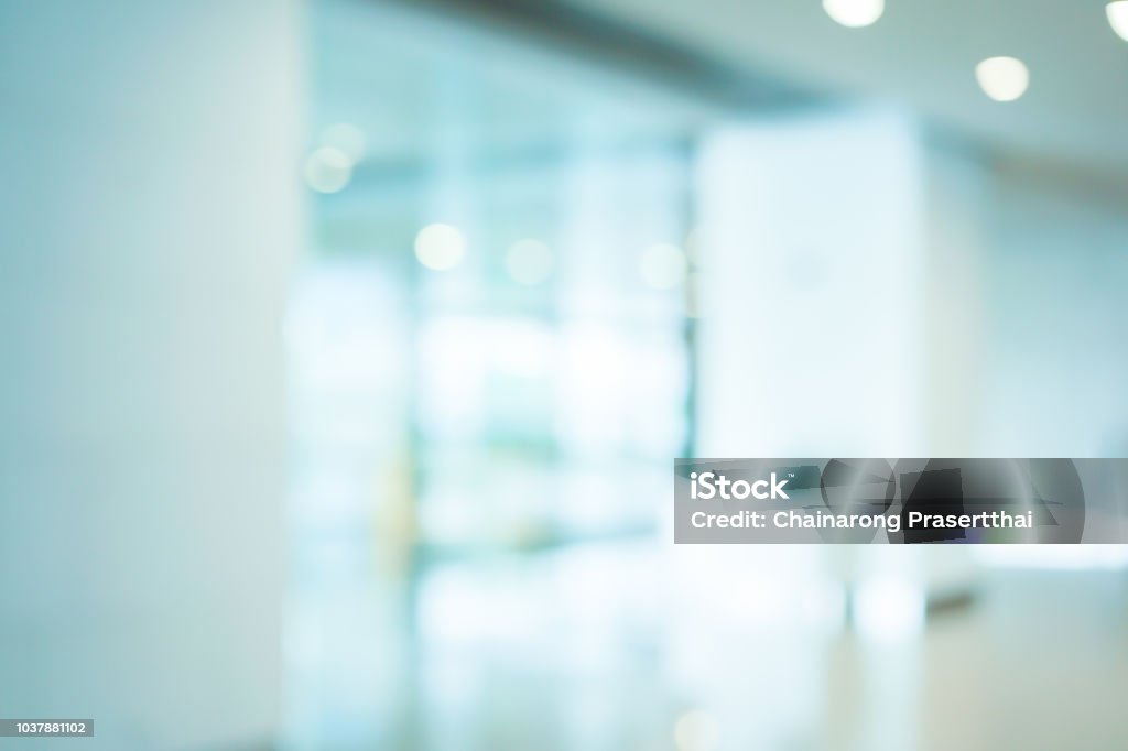 abstract blurred workplace interior with modern glass window reflective background ; loft style contemporary design of lounge or lobby for presentation and design as banner and ads Doctor's Office Stock Photo