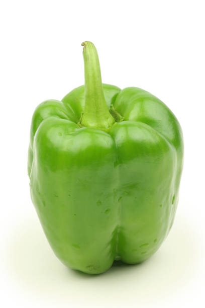istock Green bell pepper with stem on white background 1037902108