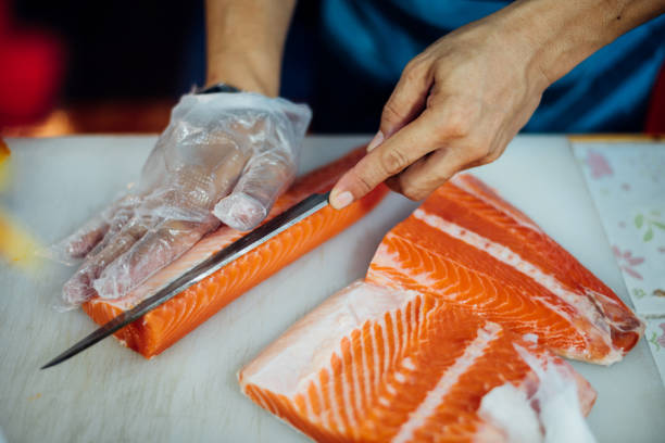 istock Asian chef slice japanese food sashimi salmon 1037908698