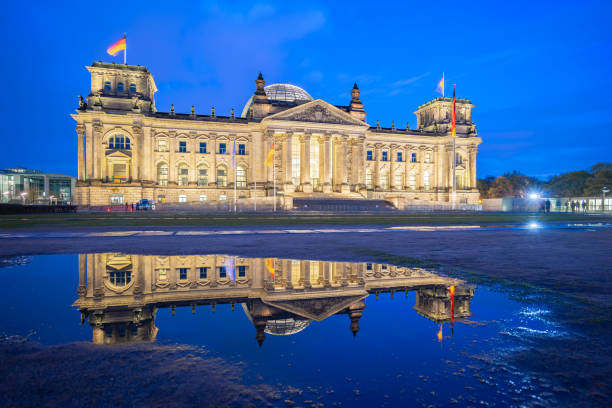 istock Deutscher Bundestag at night in Berlin city, Germany 1037926028