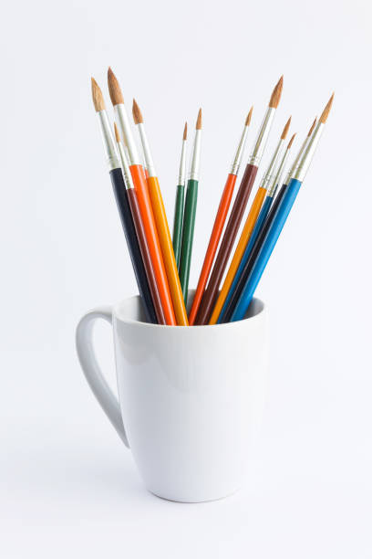 istock colorful paintbrush in ceramic glass 1037939370