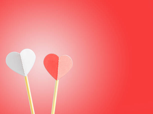 istock Two hearts on a red background. Valentine's Day. Copy space for text 1037957848