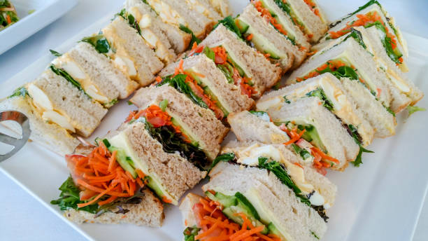istock Freshly prepared sandwiches arranged on a large plate 1037961652