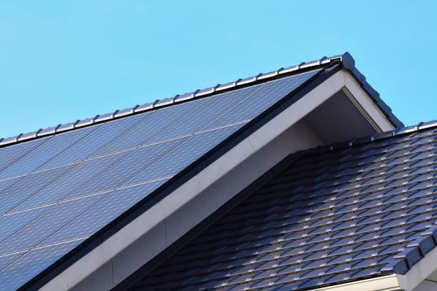 Solar panels fitted on modern house roof Solar panels fitted on modern house roof in horizontal frame house residential structure roof rooftiles stock pictures, royalty-free photos & images