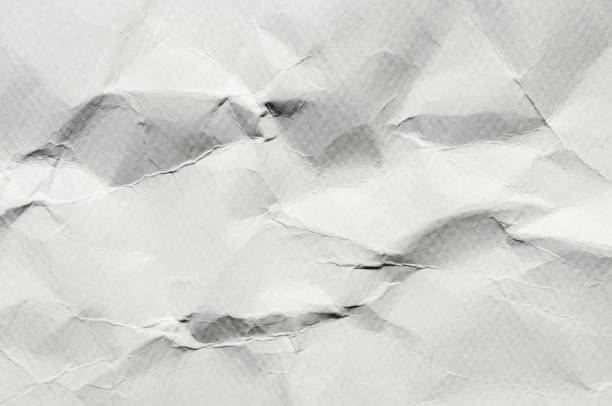 istock White background and wallpaper by crumpled paper texture and free space. 1037970168