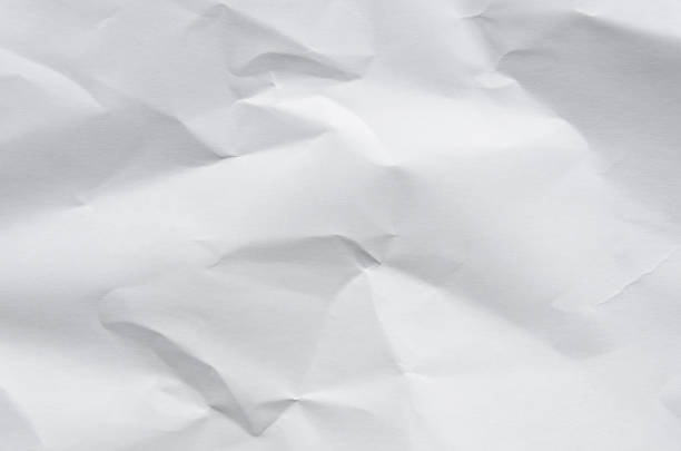 istock White background and wallpaper by crumpled paper texture and free space. 1037970236