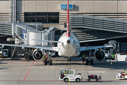 Zurich, Switzerland - 9 April 2015: An Airbus A320 of Swiss charter airline Edelweiss is parked at gate A04 of Zurich international airport.