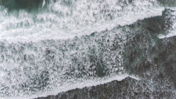 istock Aerial beach wave on tropical sea 1037977052