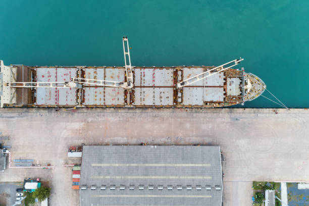 istock Aerial view drone shot of Container ship in export and import logistics,Wait for loading container,cargo Ship Waiting for export. 1037983222