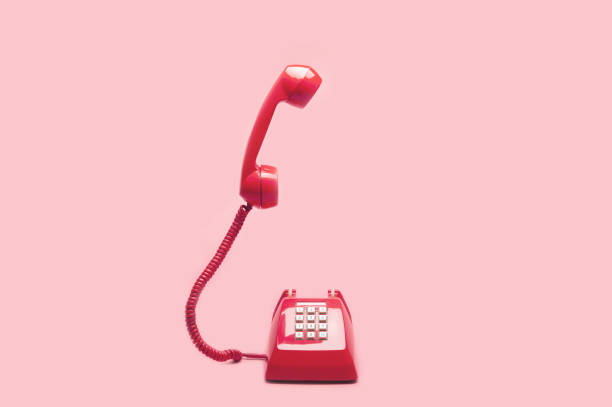 istock Retro pink telephone on pink background 1037984732