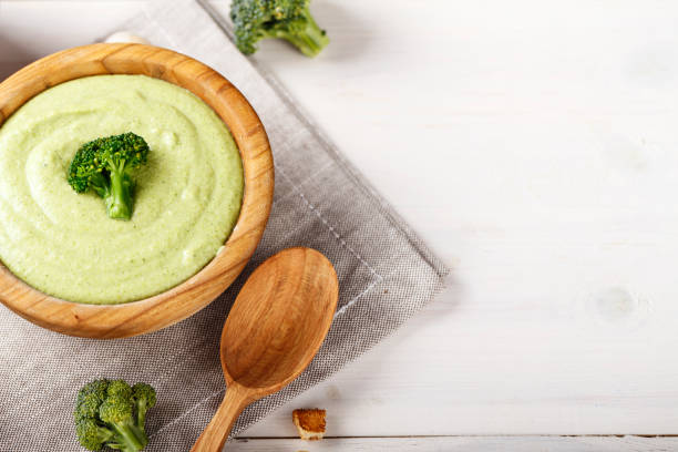 istock cream soup with broccoli with rusks and dumplings top view. 1037987132