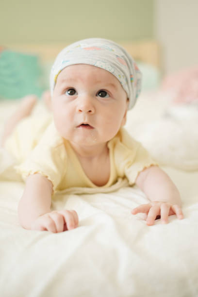istock Curious four month old baby on the bed 1037987690