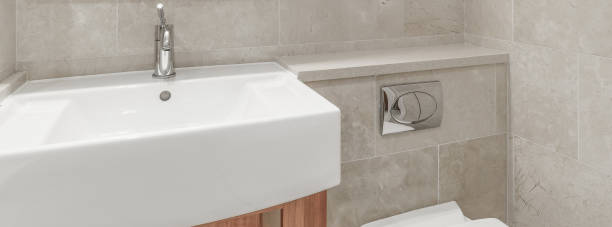 istock Modern tap and sink in a bathroom 1037999286