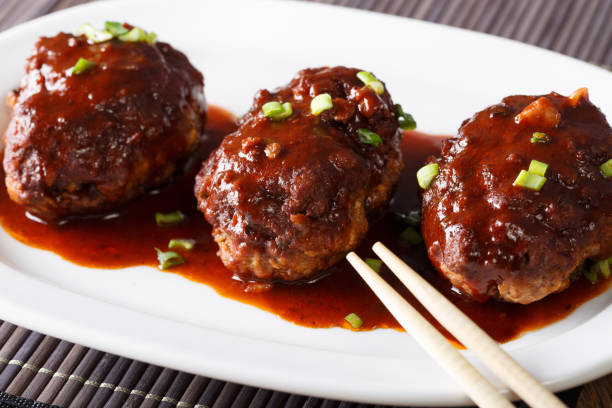 istock Delicious Japanese hambagu steak with a gravy close-up. horizontal 1038000162