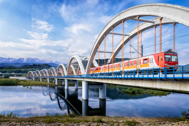 Suburb passenger train drive through the viaduct towards the Tatra Mountains Suburb passenger train drive through the viaduct towards the Tatra Mountains, Poland zakopane stock pictures, royalty-free photos & images