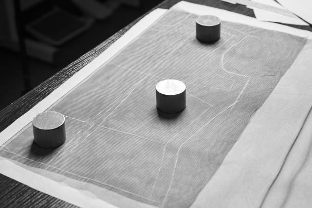 istock Marking up the fabric with tailor templets, choke, sinkers and measure tape 1038039714