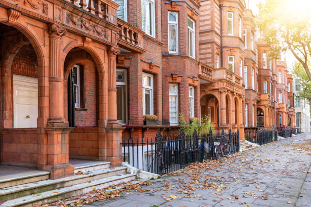 Typical, British Georgian houses in London during autumn time Typical, British Georgian houses in London, Kensington district, during autumn time with golden sunshine notting hill stock pictures, royalty-free photos & images