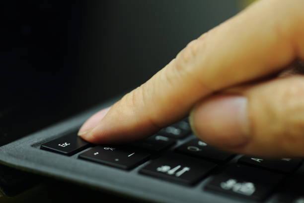 istock Finger ready to press escape button on laptop keyboard. trying to bail out from computer trouble. 1038056504