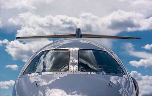 Challenging shiny windscreen of private jet inviting for travel