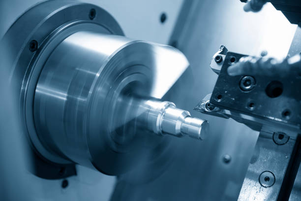 istock The  CNC lathe machine or turning machine  cutting the thread at the steel shaft. 1038088170