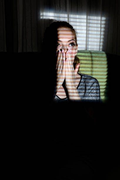 istock Woman behind the light effect like window blind or cage 1038108752