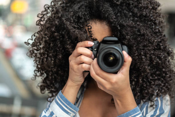 Woman taking a photography Focusing at you journalism photos stock pictures, royalty-free photos & images