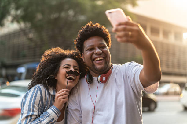 istock Young Couple Taking a Selfie Outdoors 1038145420