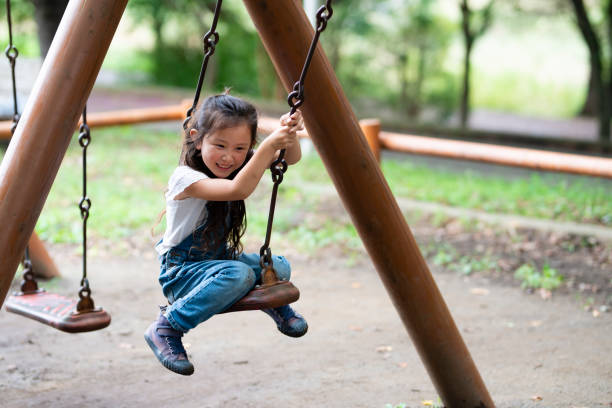 istock Girl playing in the park 1038152870