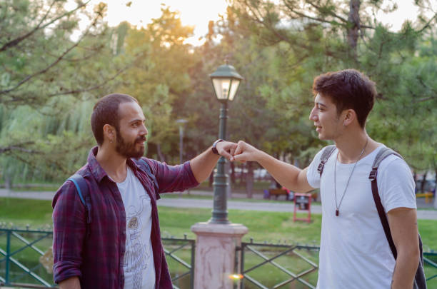 istock People bumping their fists together,greetings. 1038157306