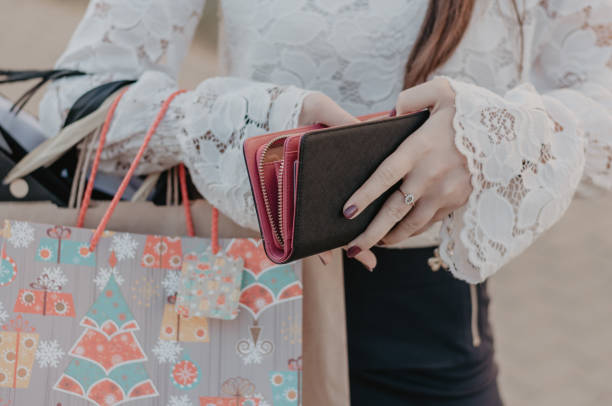 istock Woman with purchases holding a leather purse 1038160822