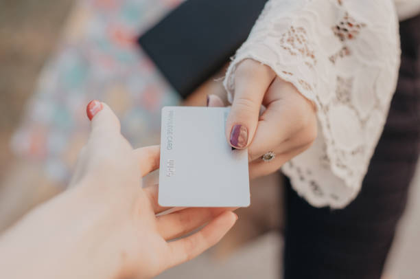 Hands holding debit card. Paying credit card stock photo