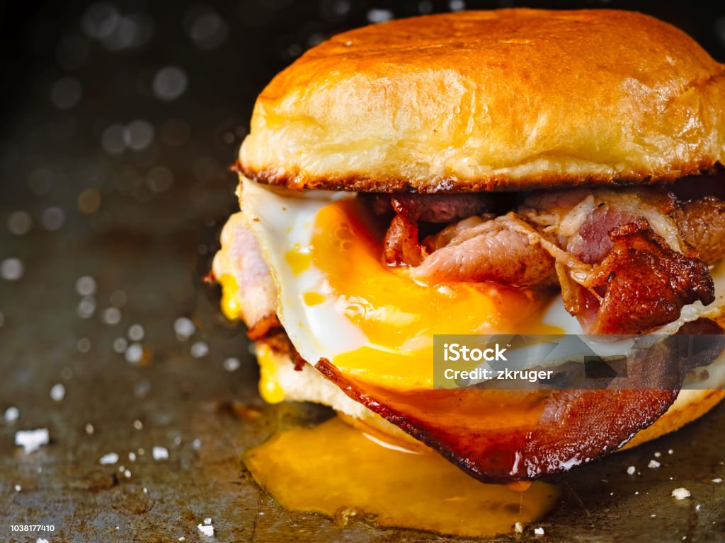 rustic bacon egg breakfast sandwich bun close up of rustic bacon egg breakfast sandwich bun Breakfast Stock Photo