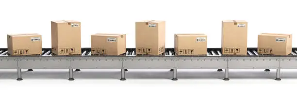 Photo of E-commerce, delivery and packaging service concept. Cardboard boxes on conveyor line isolated on white background.