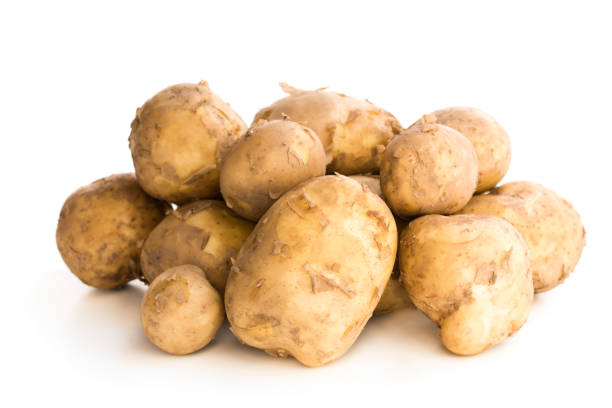 istock New potatoes  isolated on white 1038184348